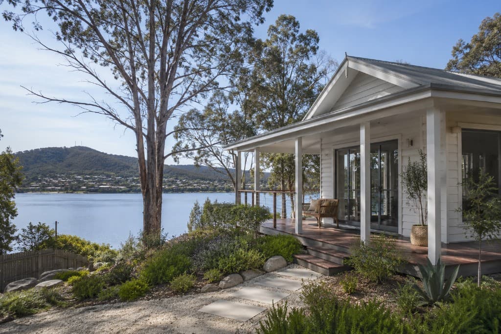 Lakeview Cottage overlooking a peaceful lake with garden and deck